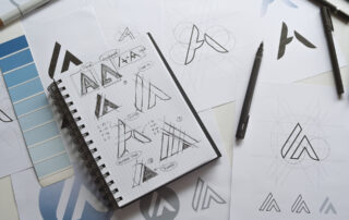 Graphic designer drawing sketch design creative Ideas draft Logo product trademark label brand artwork. Graphic designer studio Concept.